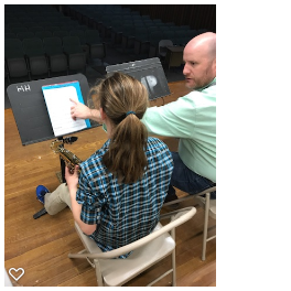Mr. Borning provides small group lessons to his students in addition to ensemble rehearsal time during school 